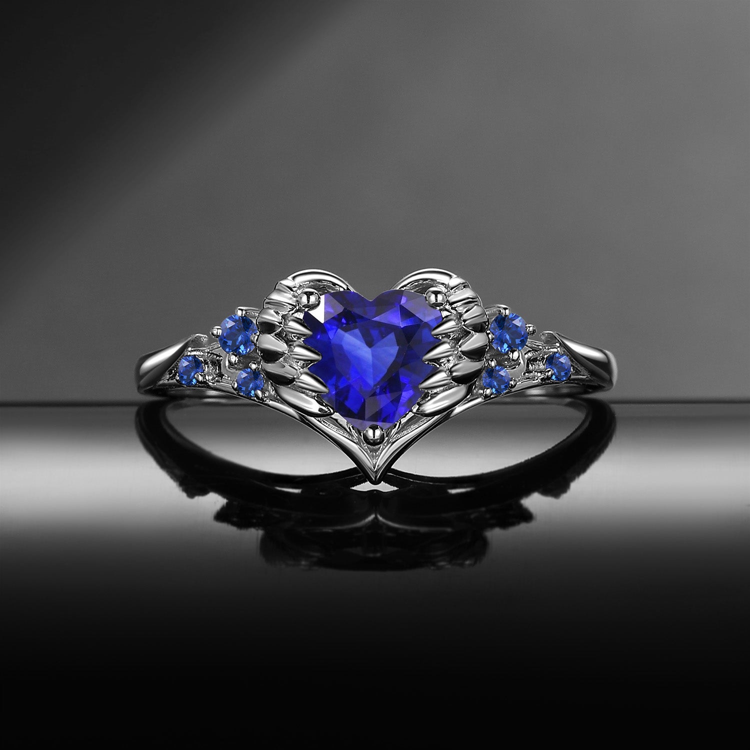 'Pierced Heart' – Gothic Lab Sapphire Heart & Sword Engagement Ring with Angel Wing Detail