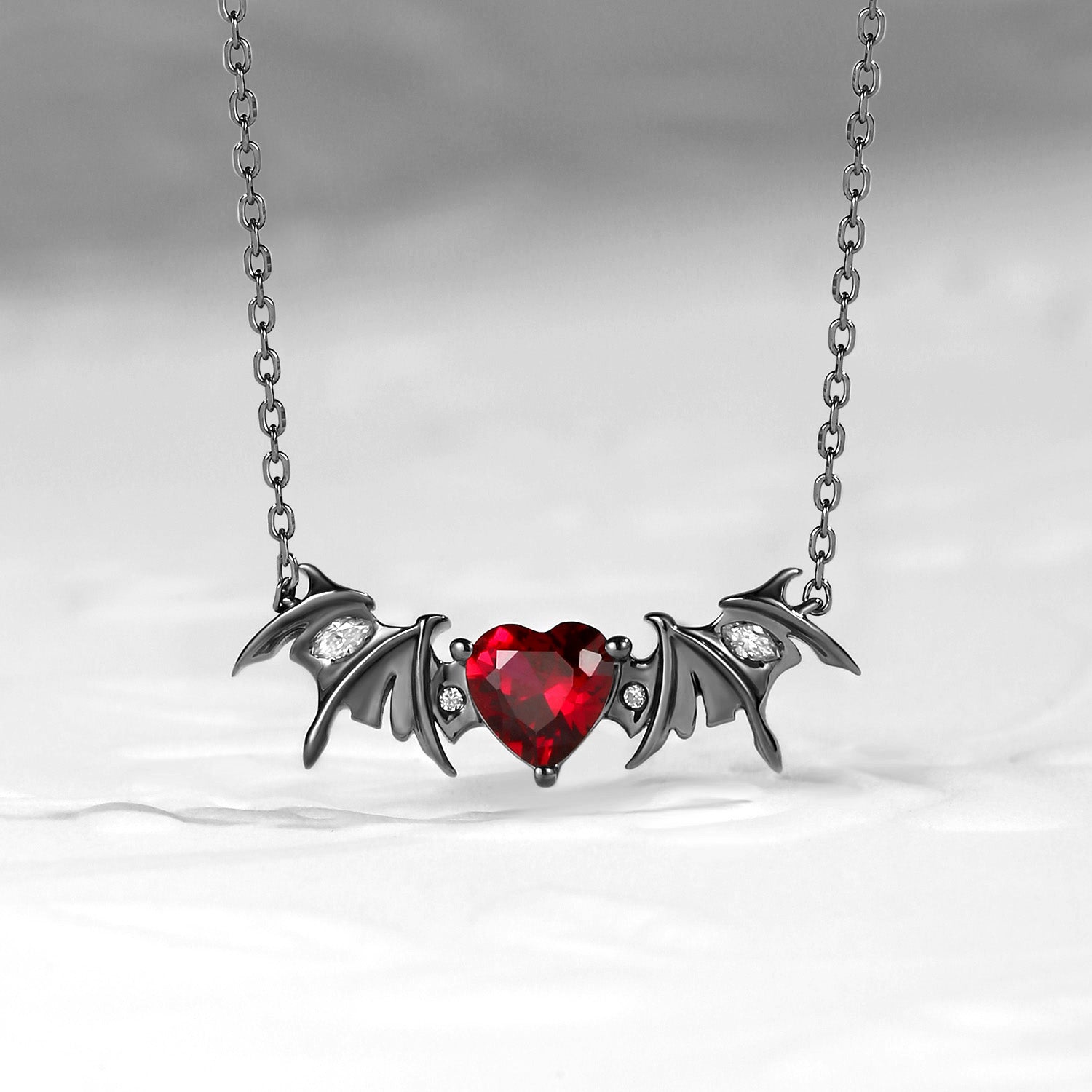 Bat Wing Garnet Heart Cut Necklace