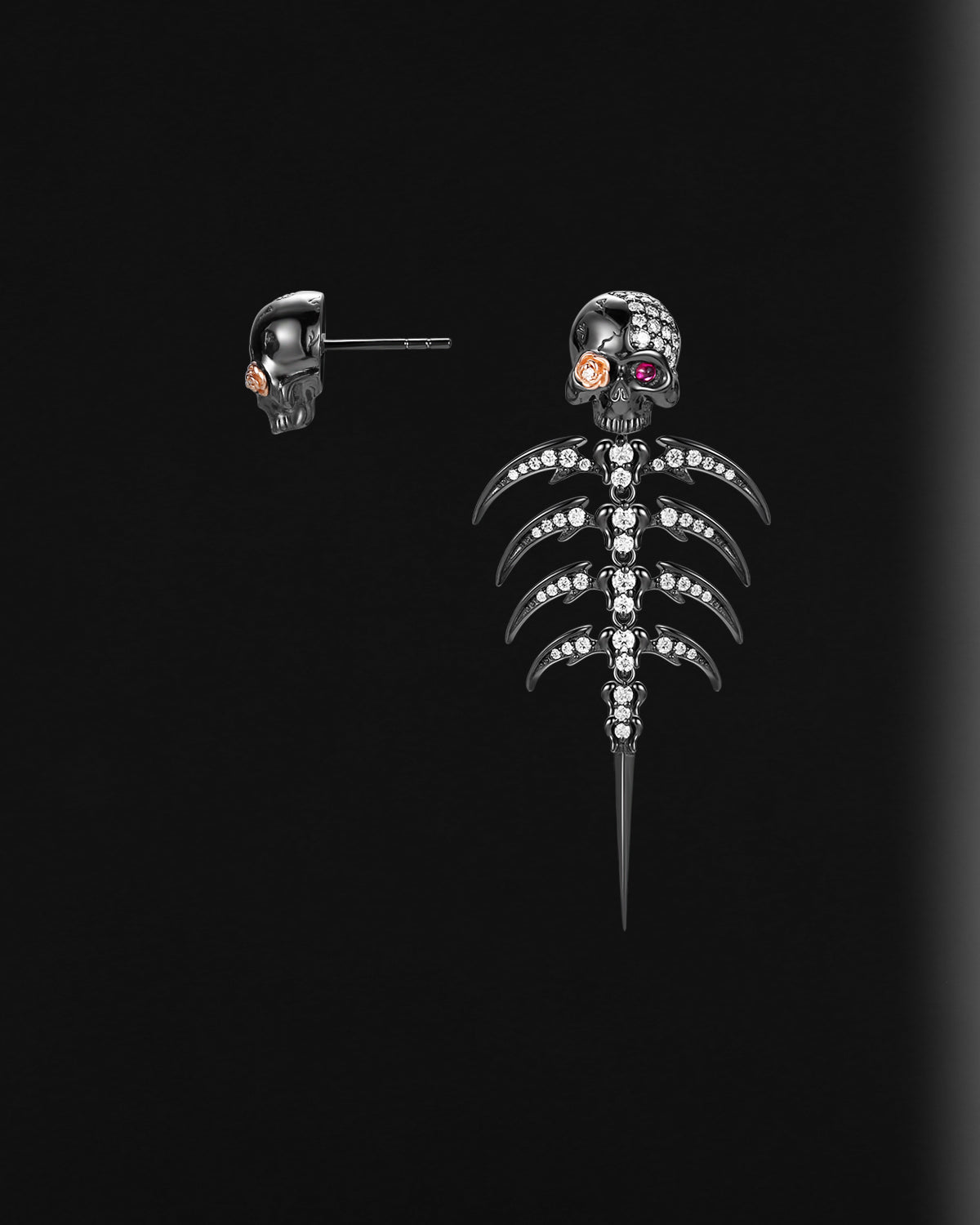 Skull-shaped earring with clear stones on a black background
