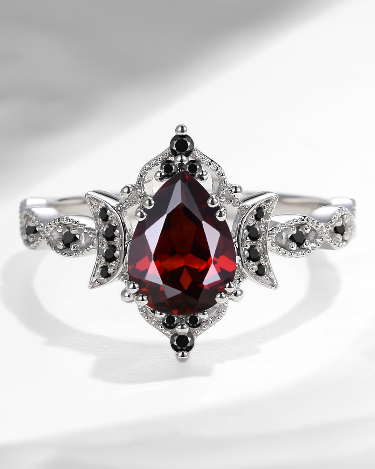 Unique Garnet Engagement Ring In Pear Shape
