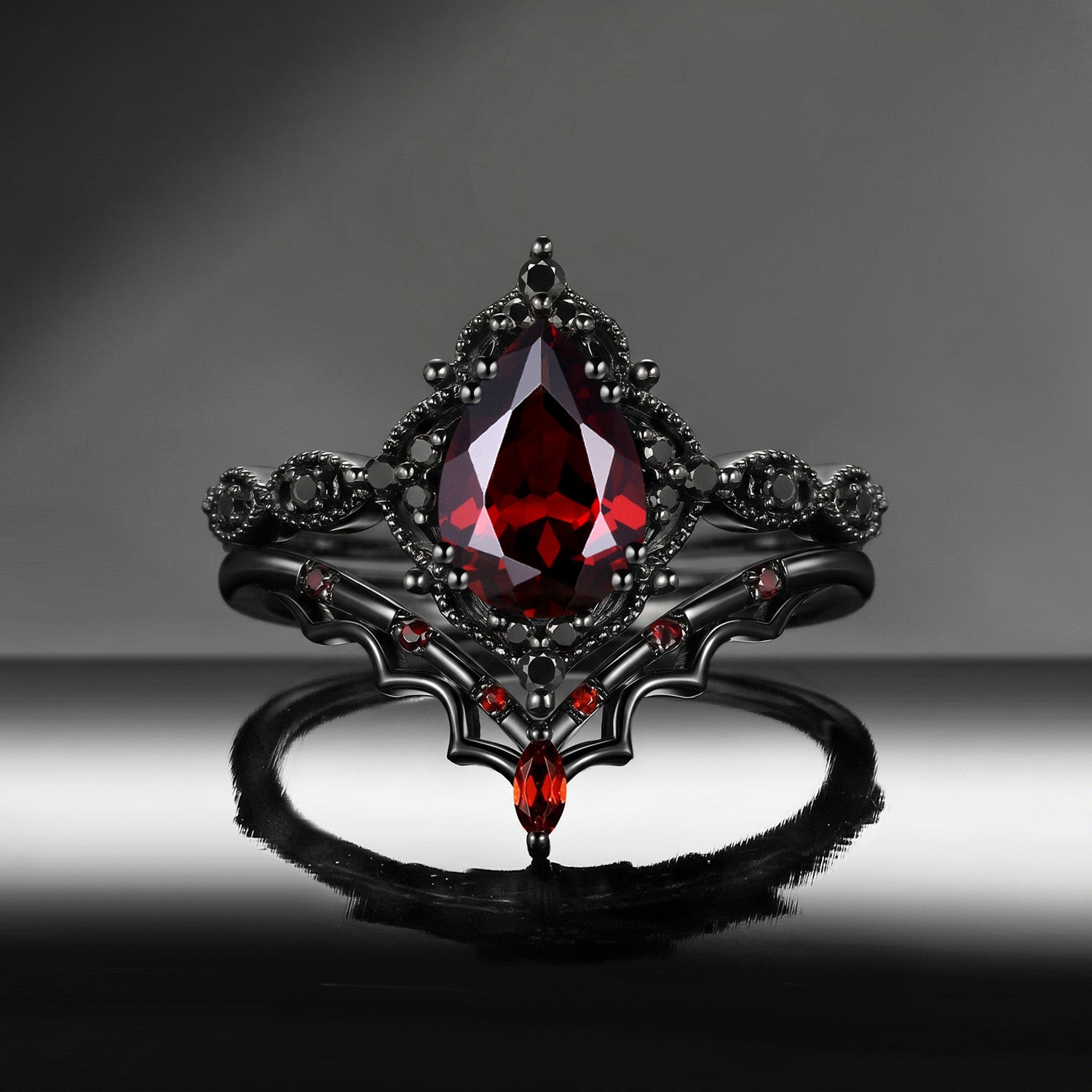 'Bat's Whisper' - Gothic Pear Cut Garnet Alternative Bridal Engagement Ring Set with Bat Wings in Black Gold