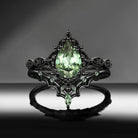 'Bat's Whisper' - Gothic Pear Cut Lab Green Sapphire Alternative Bridal Engagement Ring Set with Bat Wings in Black Gold
