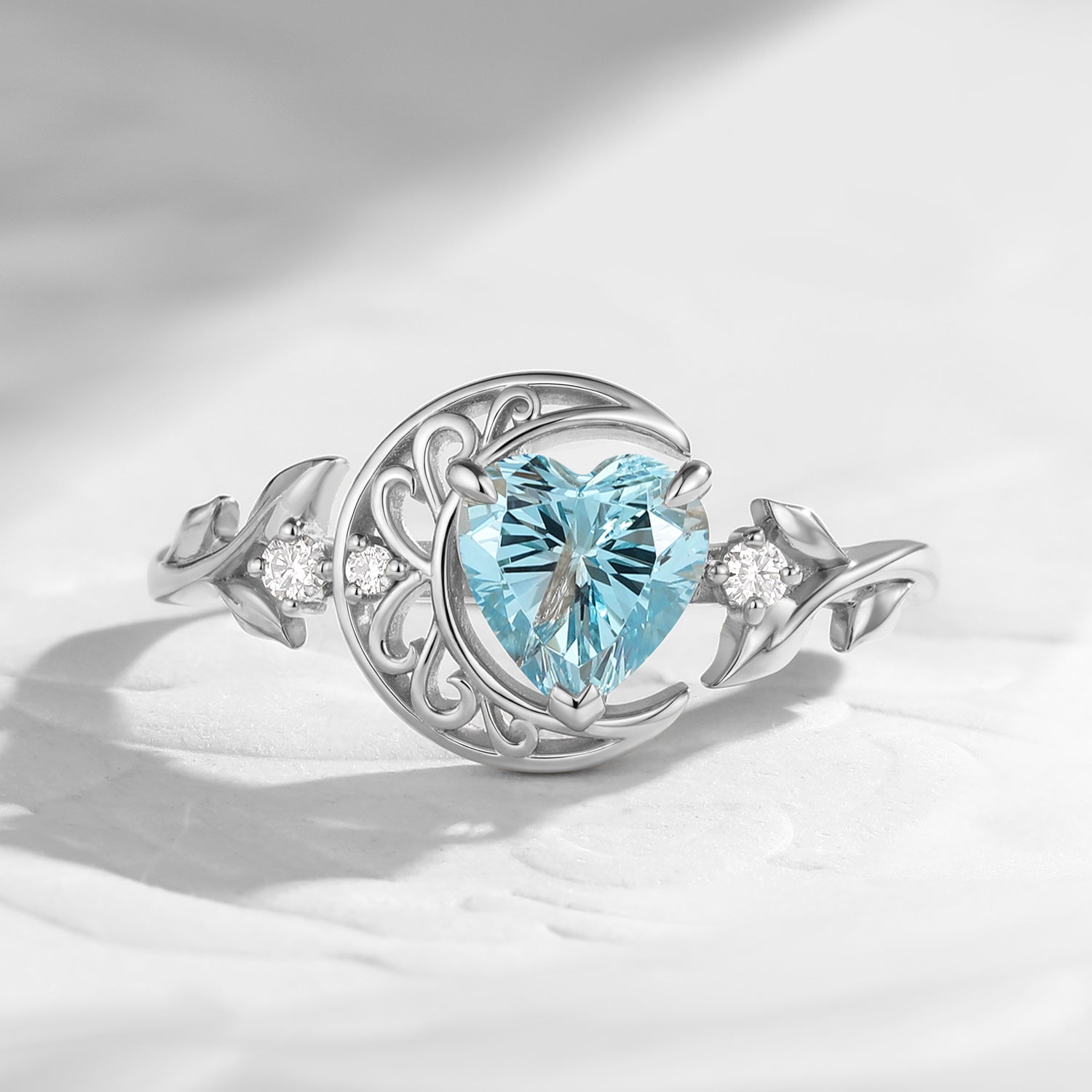 'Moonlit Embrace' - Nature Inspired Heart Cut Swiss Blue Topaz Hollow Crescent Moon Engagement Ring with Leaf-inspired Band
