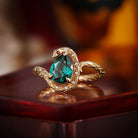 Serpent's Embrace - Gothic Pear Cut Lab Emerald Snake Engagement Ring with Snake-skin Textured Band