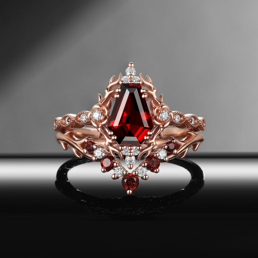 Gothic coffin cut red garnet engagement ring with thorn inspired band