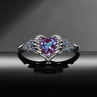 'Pierced Heart' – Gothic Color-Changing Lab Alexandrite Heart & Sword Engagement Ring with Angel Wing Detail