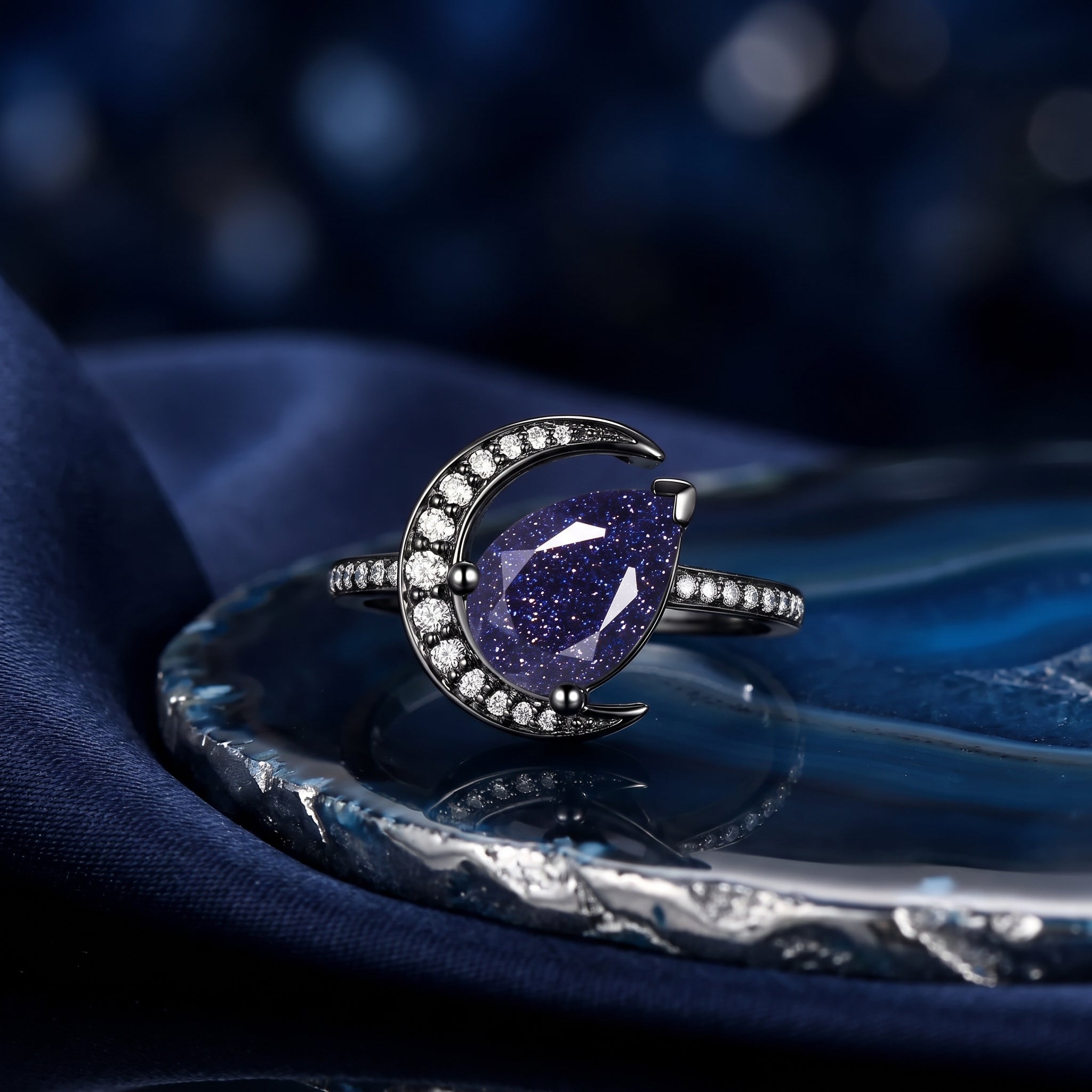 'Moonlit Reverie' - Tilted Pear Cut Blue Sandstone Crescent Moon Engagement Ring