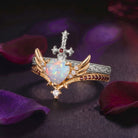 Heart & Sword - Gothic Cabochon Heart Cut Lab Opal Two-Tone Bridal Set with Angel Wing-inspired Band