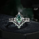 'Elara' - Antique Pear Cut Green Moissanite Engagement Ring Set in Black Gold