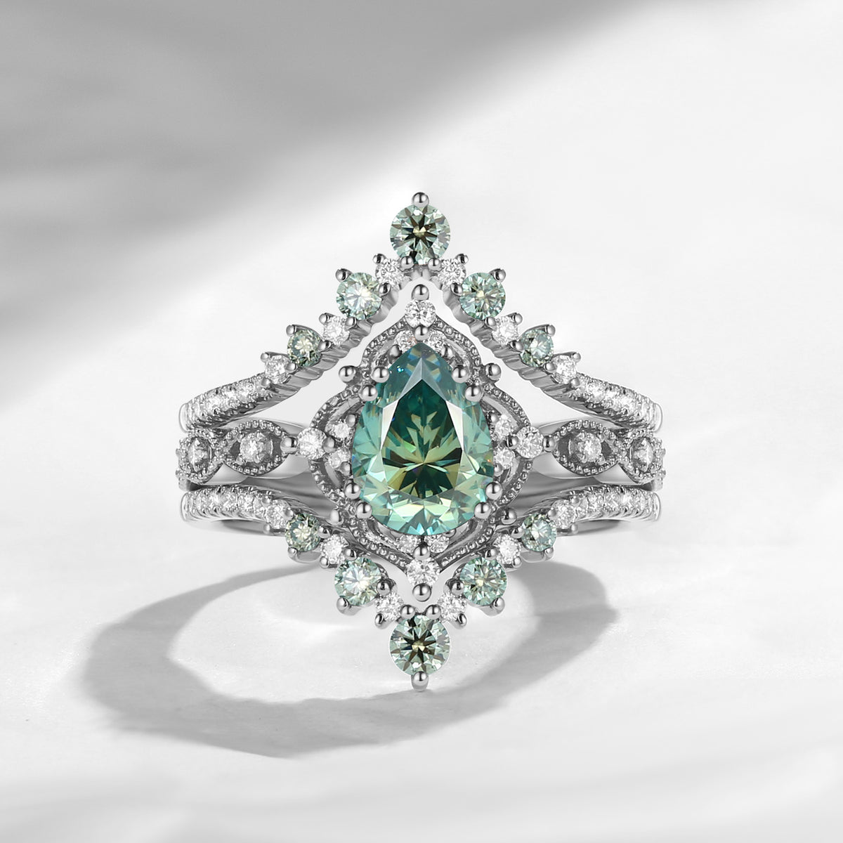 'Elara' - Vintage Pear Cut Green Moissanite Engagement Ring Set with Milgrain Detailing